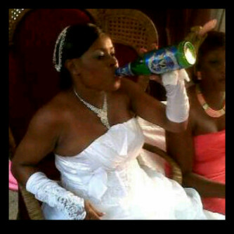 Lady_Drinking_Beer_On_Wedding_Gown.jpg
